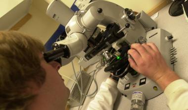 Scientist on microscope